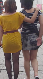 跟拍黄裙黑丝性感少妇