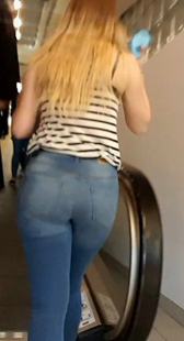 商场紧身圆臀牛仔少妇