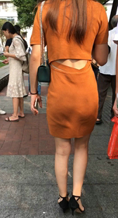 桔色包臀裙长发美女